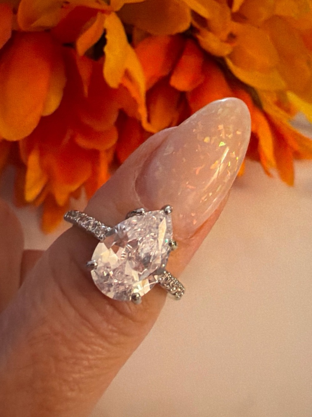 Sparkling Pear-Shaped White CZ Ring with Pavé Silver Band